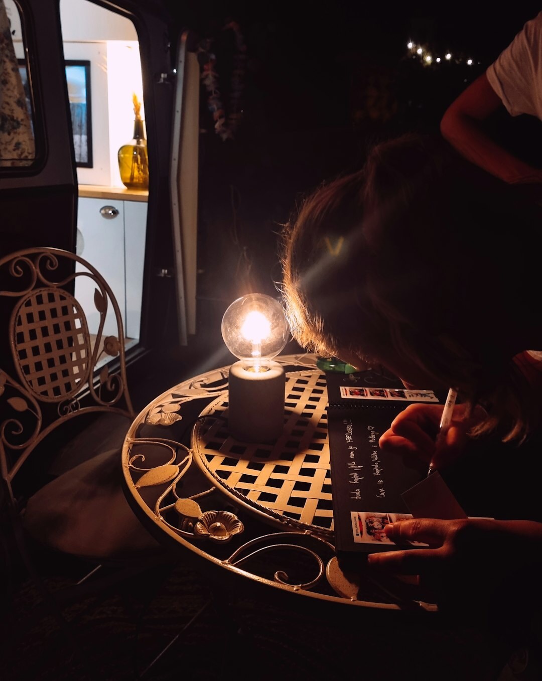 Croatian mystery writer typing on a typewriter under lamp light