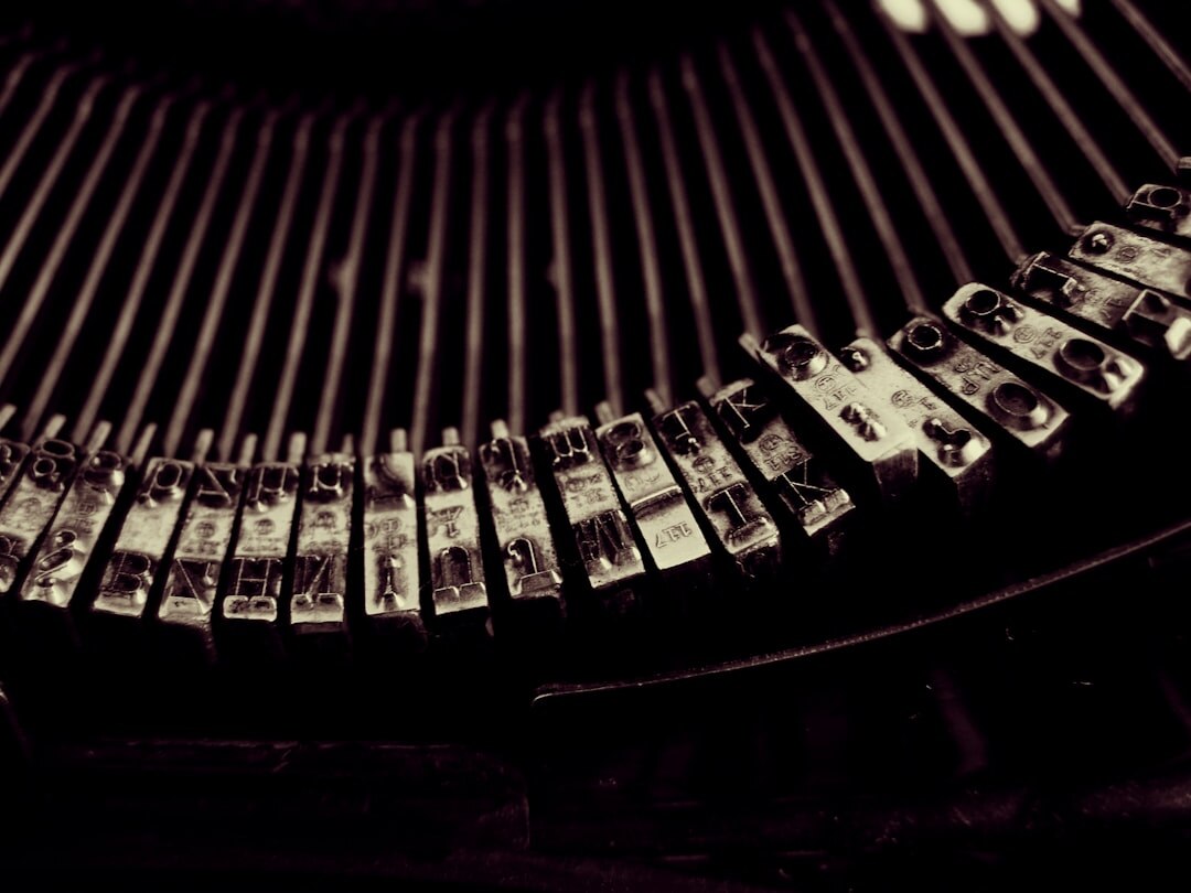 Close up of an old typewriter with paper, moody dark tones